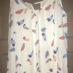 A woman’s off the shoulder dress shirt